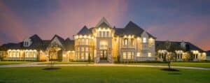 White and black lighted house mansion in California